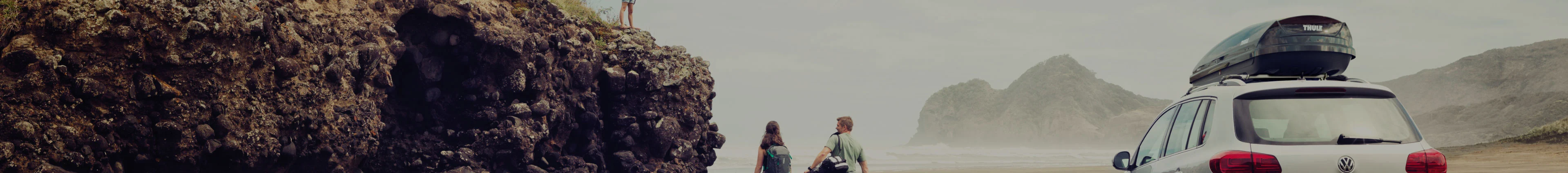 Beach travellers with Roof Rack holding beach gear